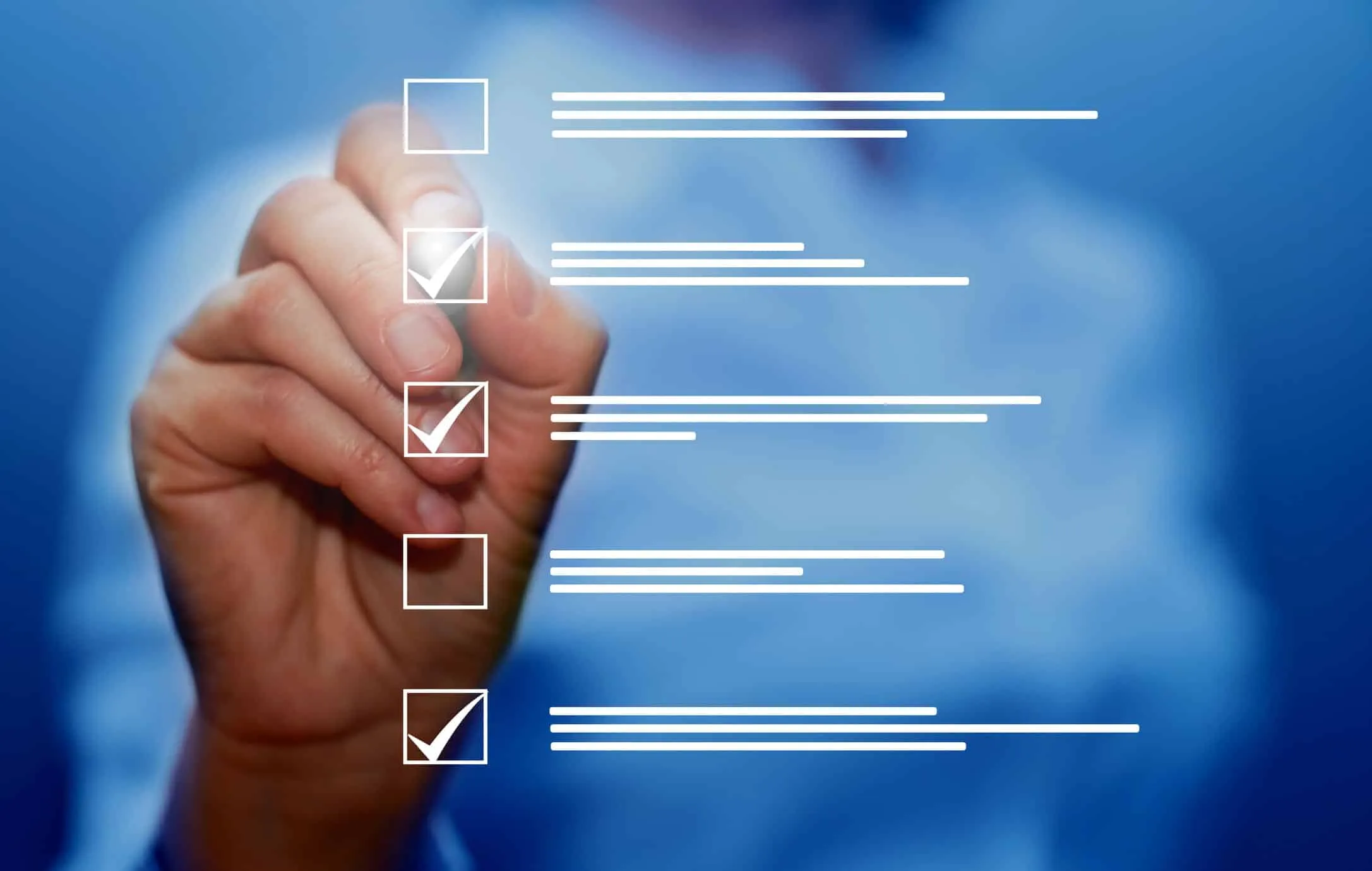 Hand checking boxes on a checklist