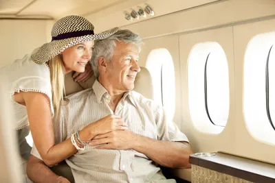 Couple relaxing together in a private jet cabin