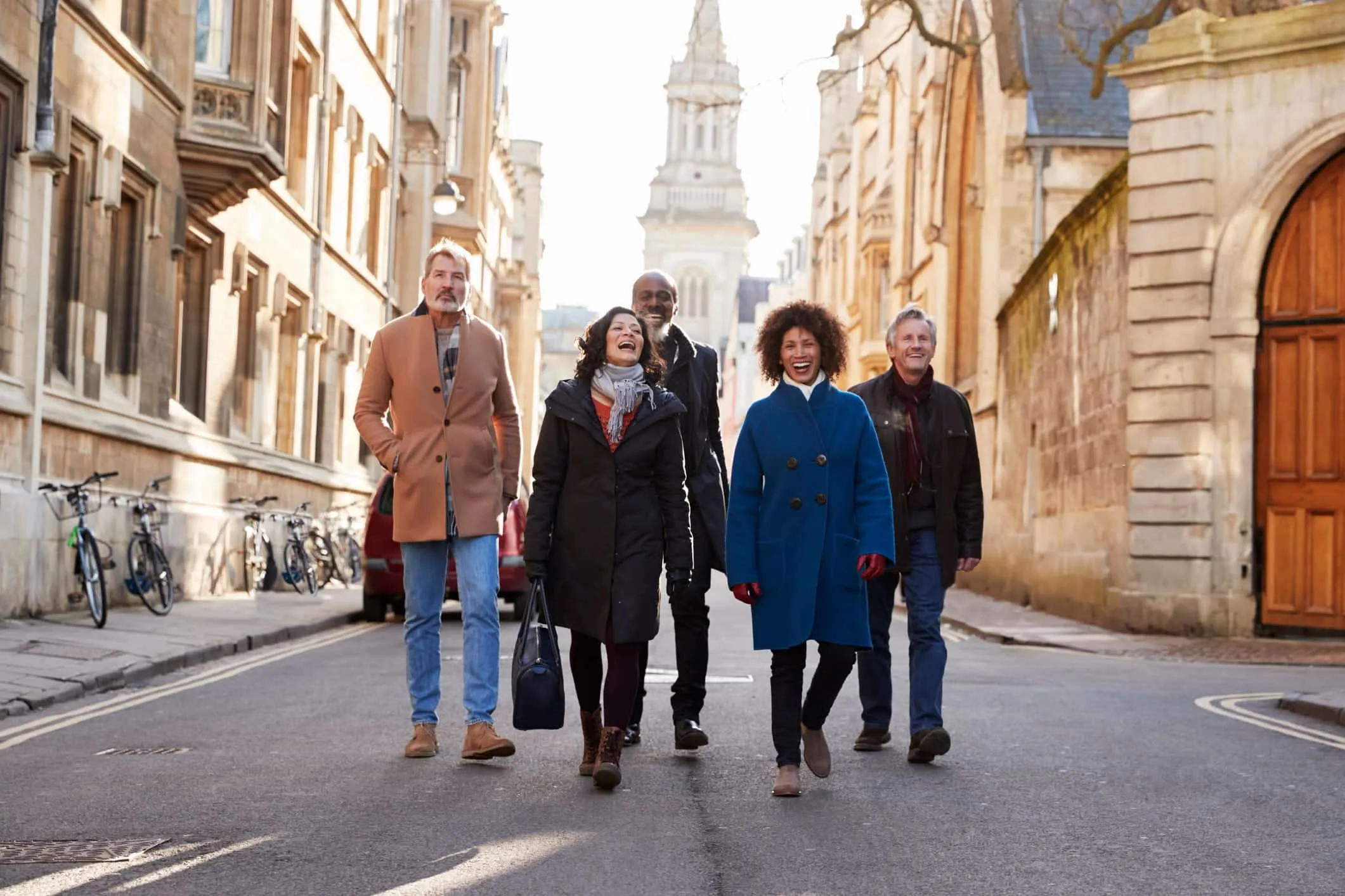 Group of adults walking together down a city street